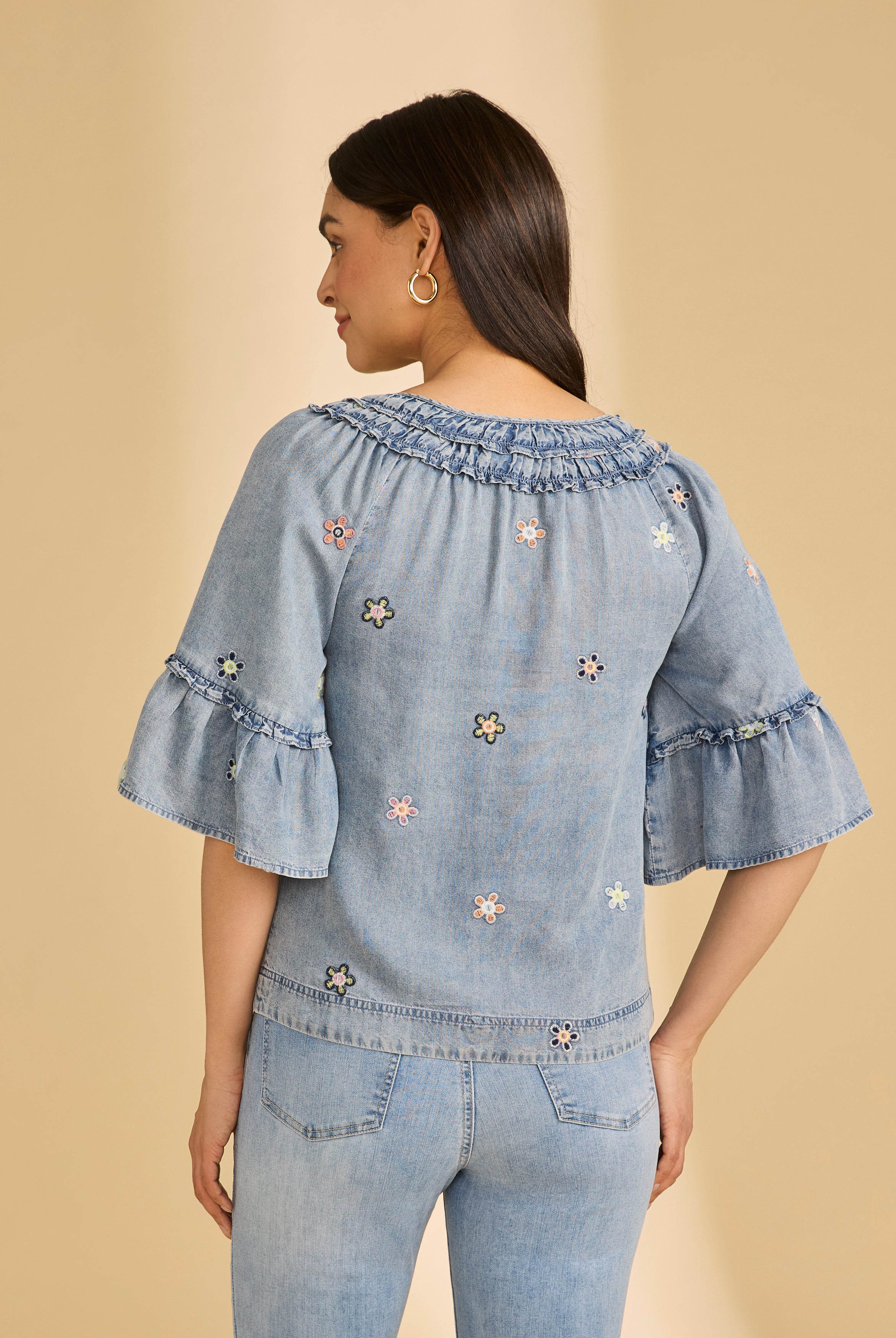 Back view of denim top with floral embroidery and flared sleeves by French Dressing Jeans (FDJ)