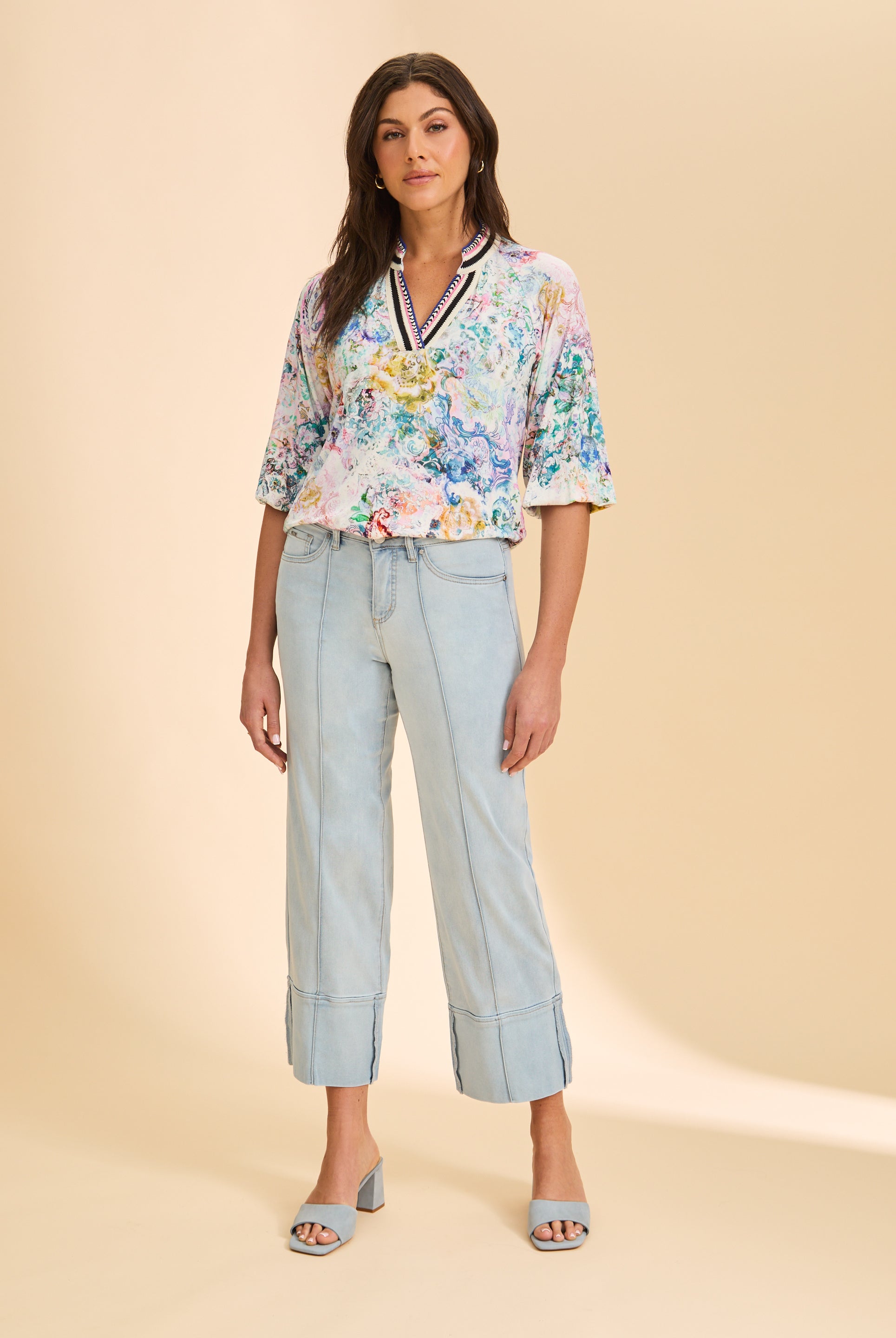 Full view of multicolored floral top styled with light denim jeans by French Dressing Jeans (FDJ)