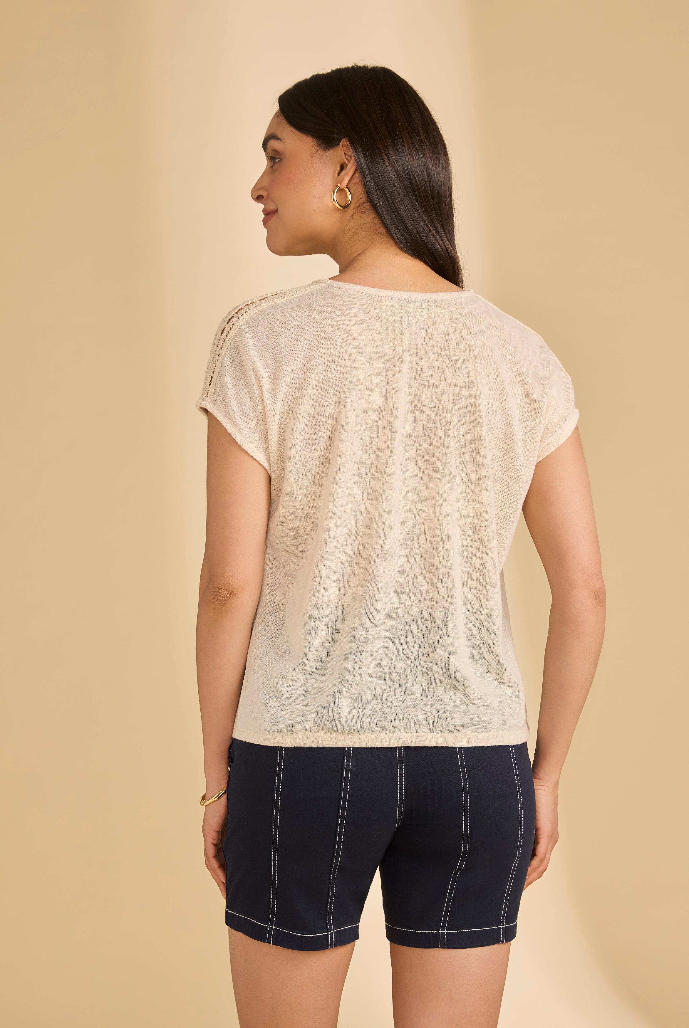 Back view of beige V-neck top showcasing crochet shoulder design by French Dressing Jeans (FDJ)