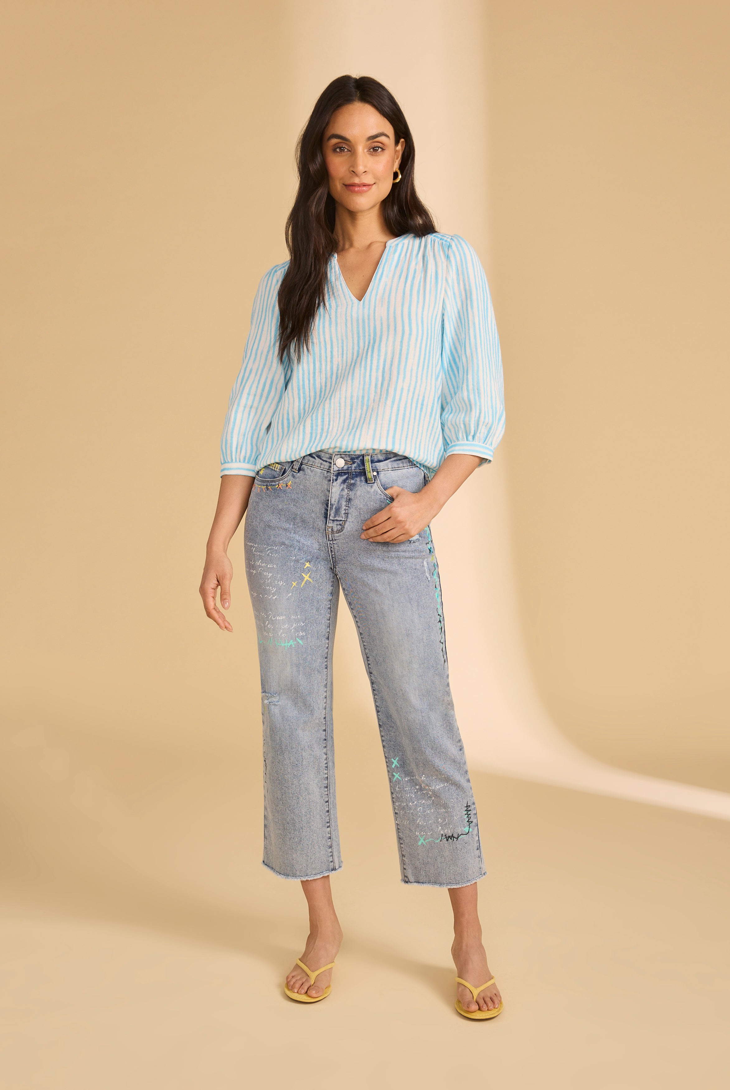 Model in embroidered ocean denim jeans with relaxed fit by French Dressing Jeans (FDJ)
