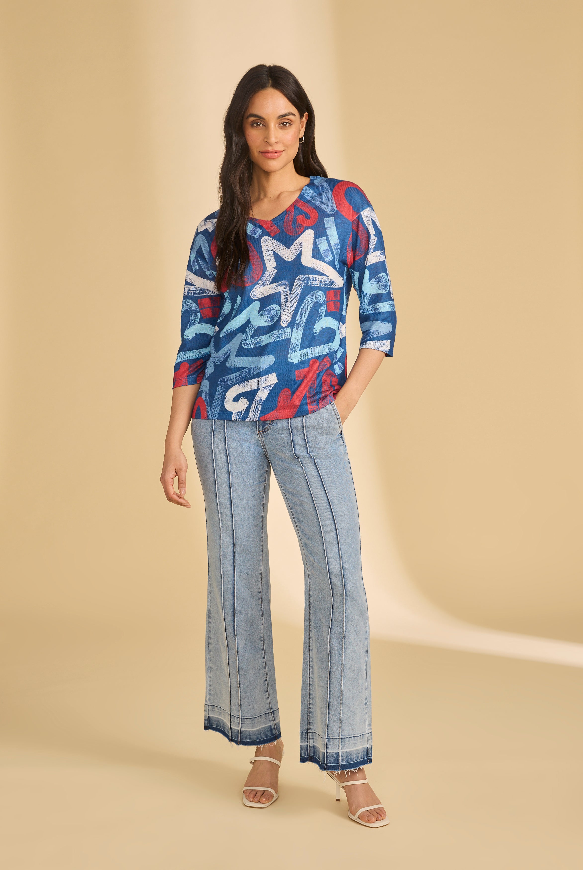 Full view of blue graphic top with flared jeans, casual look by French Dressing Jeans (FDJ)