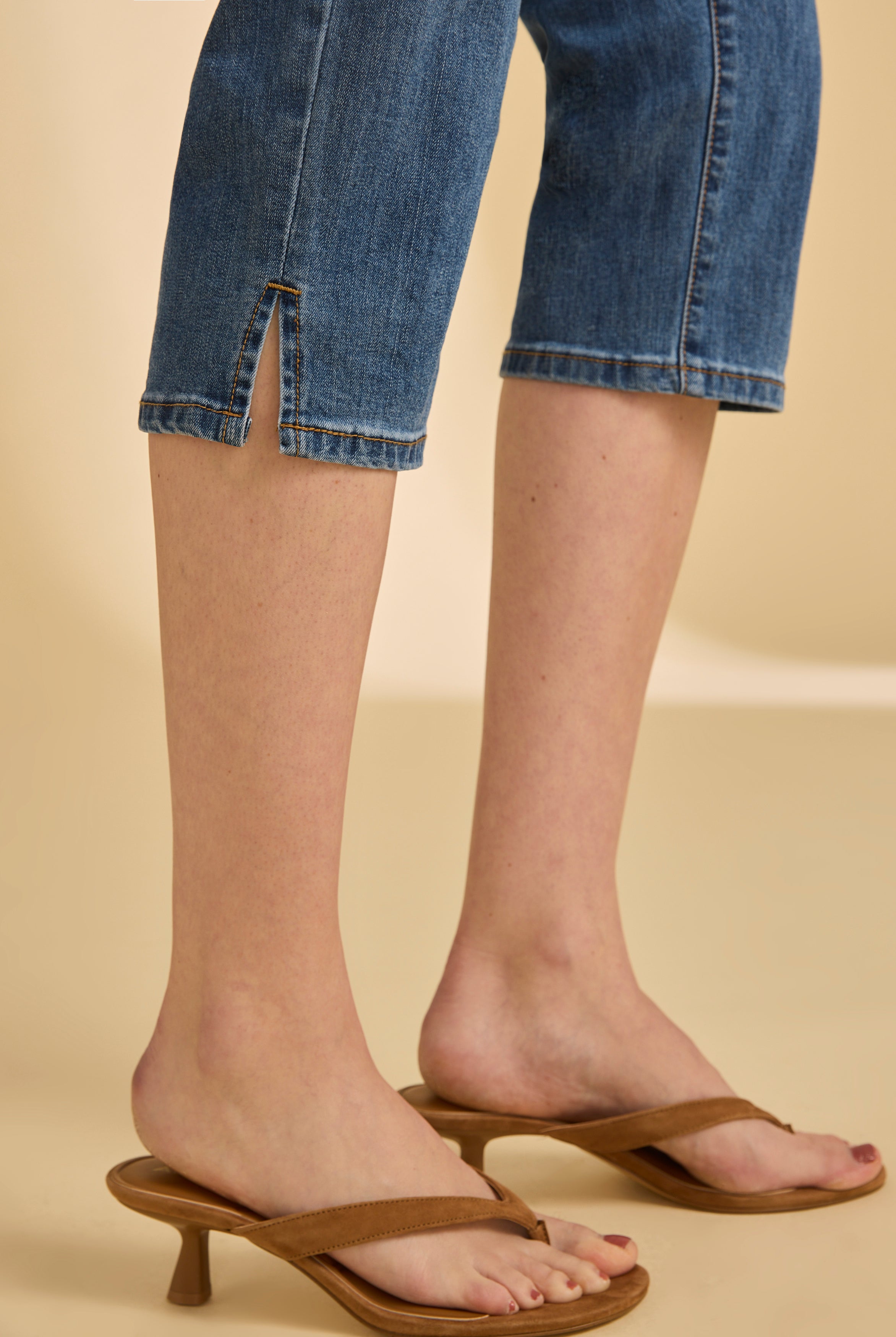 Close-up of darker indigo blue cropped jeans showing slit detail by French Dressing Jeans (FDJ)
