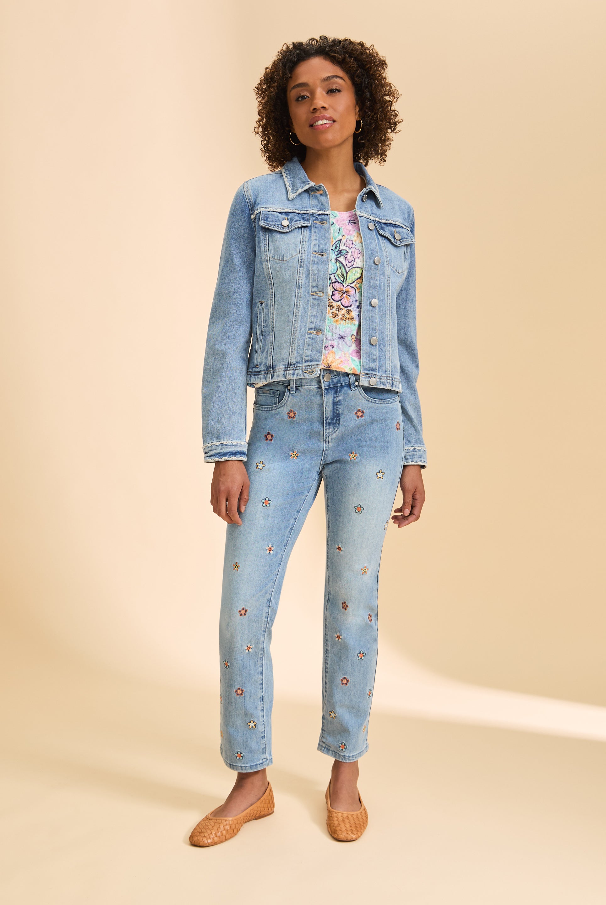 Full body view of denim jacket paired with floral pants, showcasing casual style by French Dressing Jeans (FDJ)