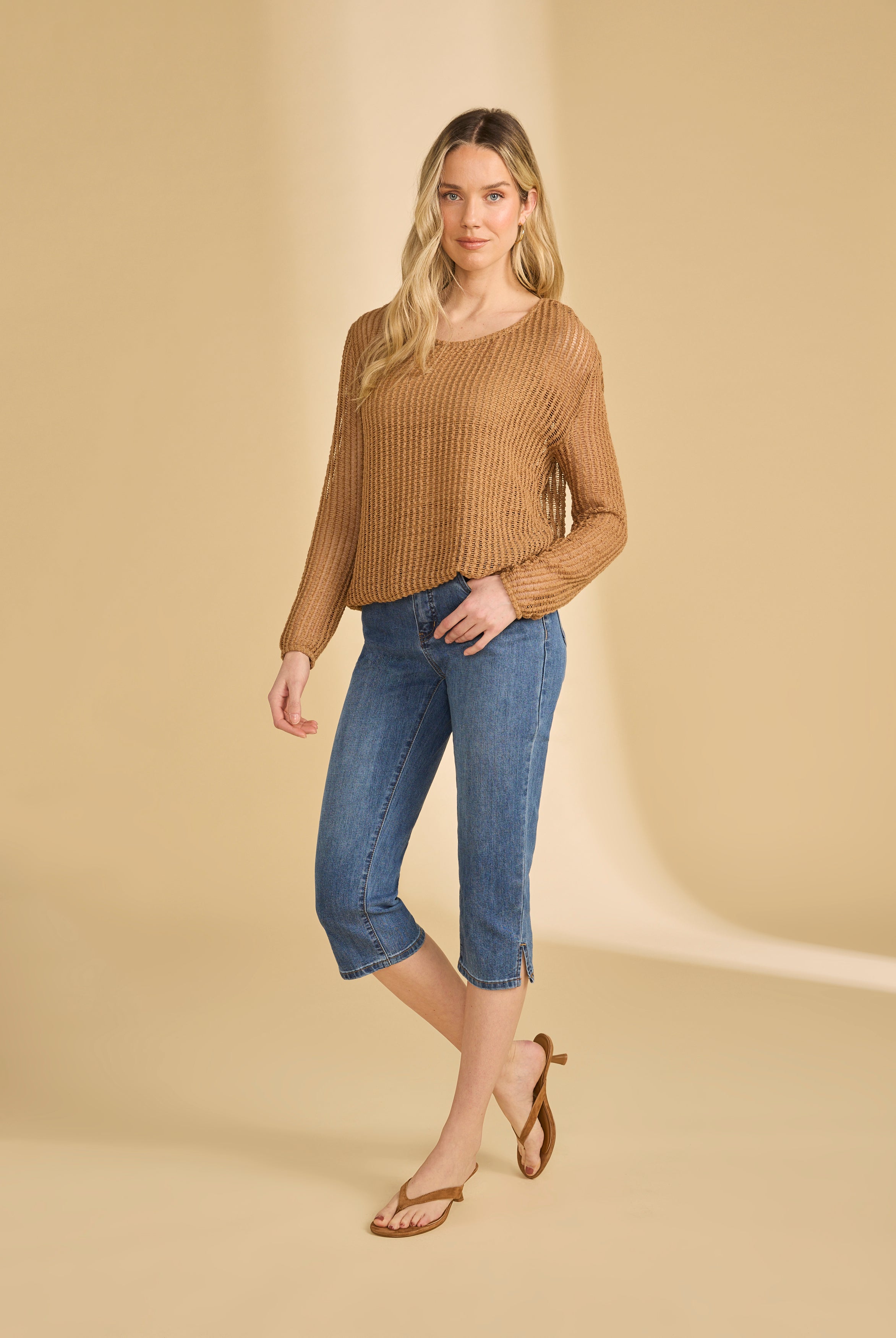 Full body view of darker indigo blue cropped jeans styled with long-sleeve top by French Dressing Jeans (FDJ)