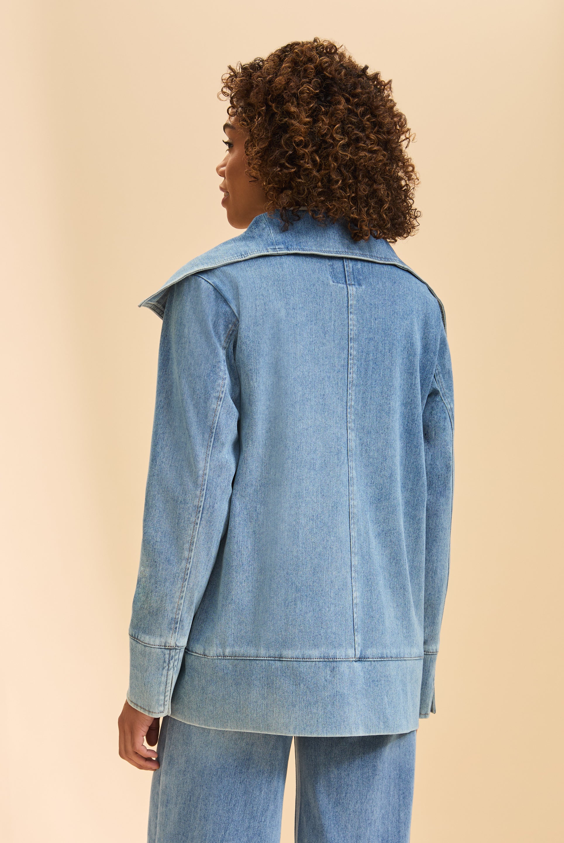 Back view of light blue denim jacket highlighting seam detail and wide collar by French Dressing Jeans (FDJ)