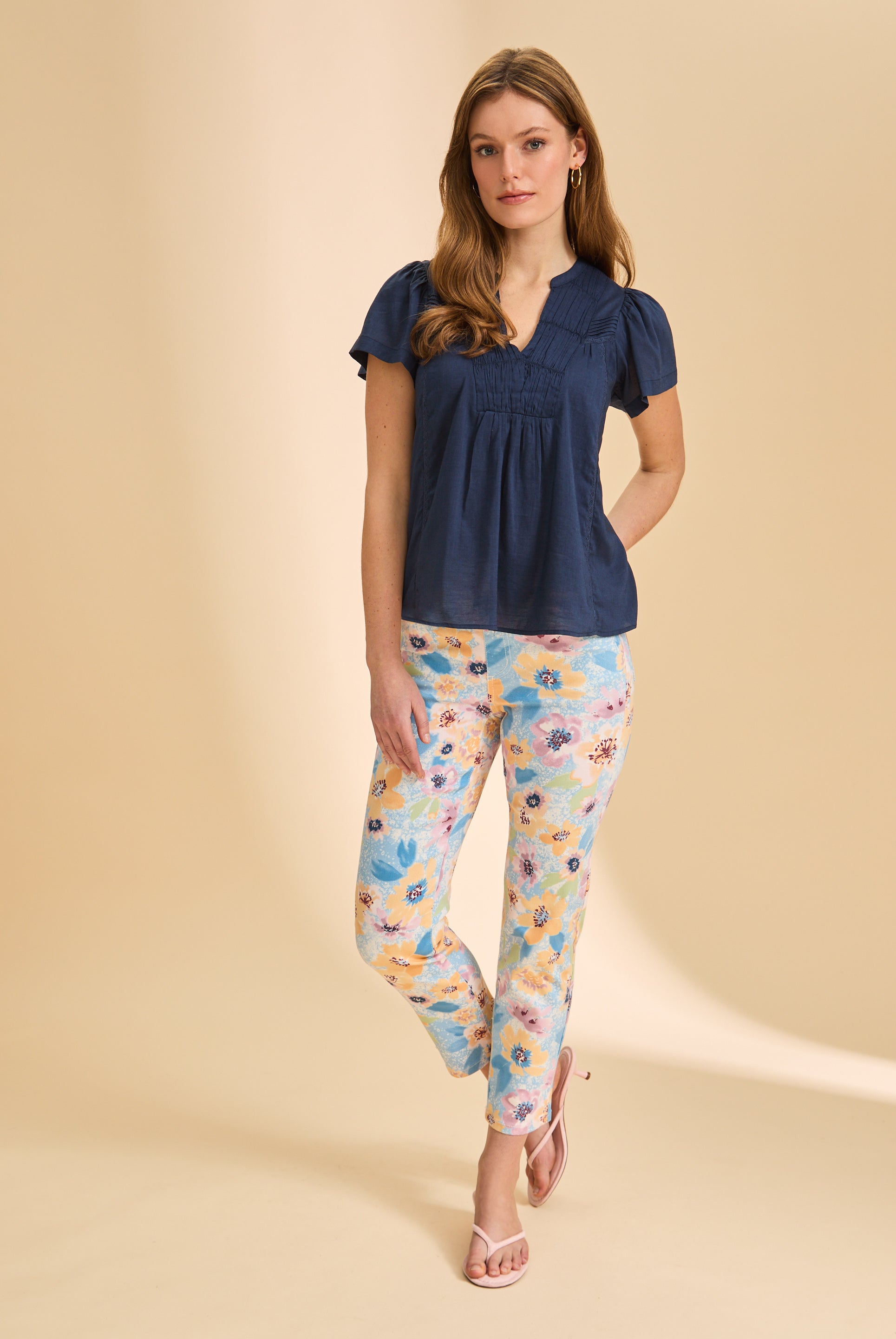 Full view of navy short-sleeve top paired with floral pants by French Dressing Jeans (FDJ)