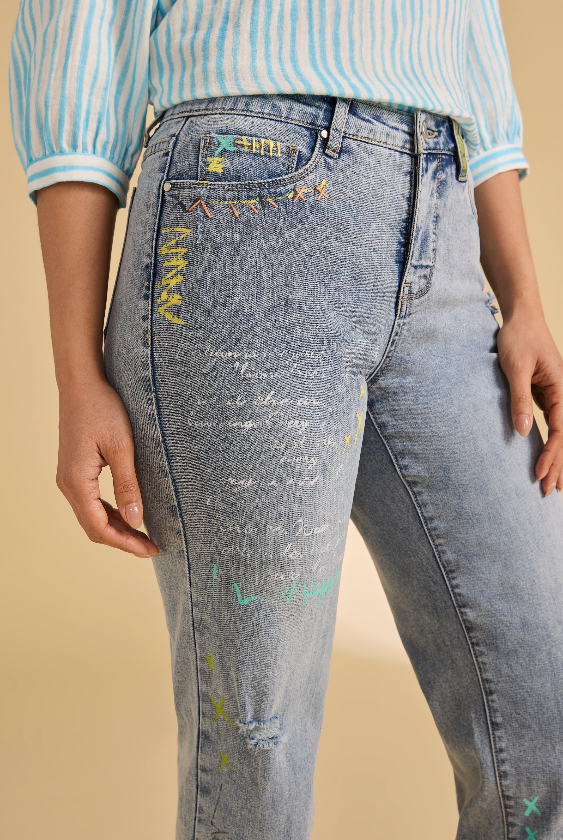 Close-up of colorful embroidery on ocean denim jeans by French Dressing Jeans (FDJ)