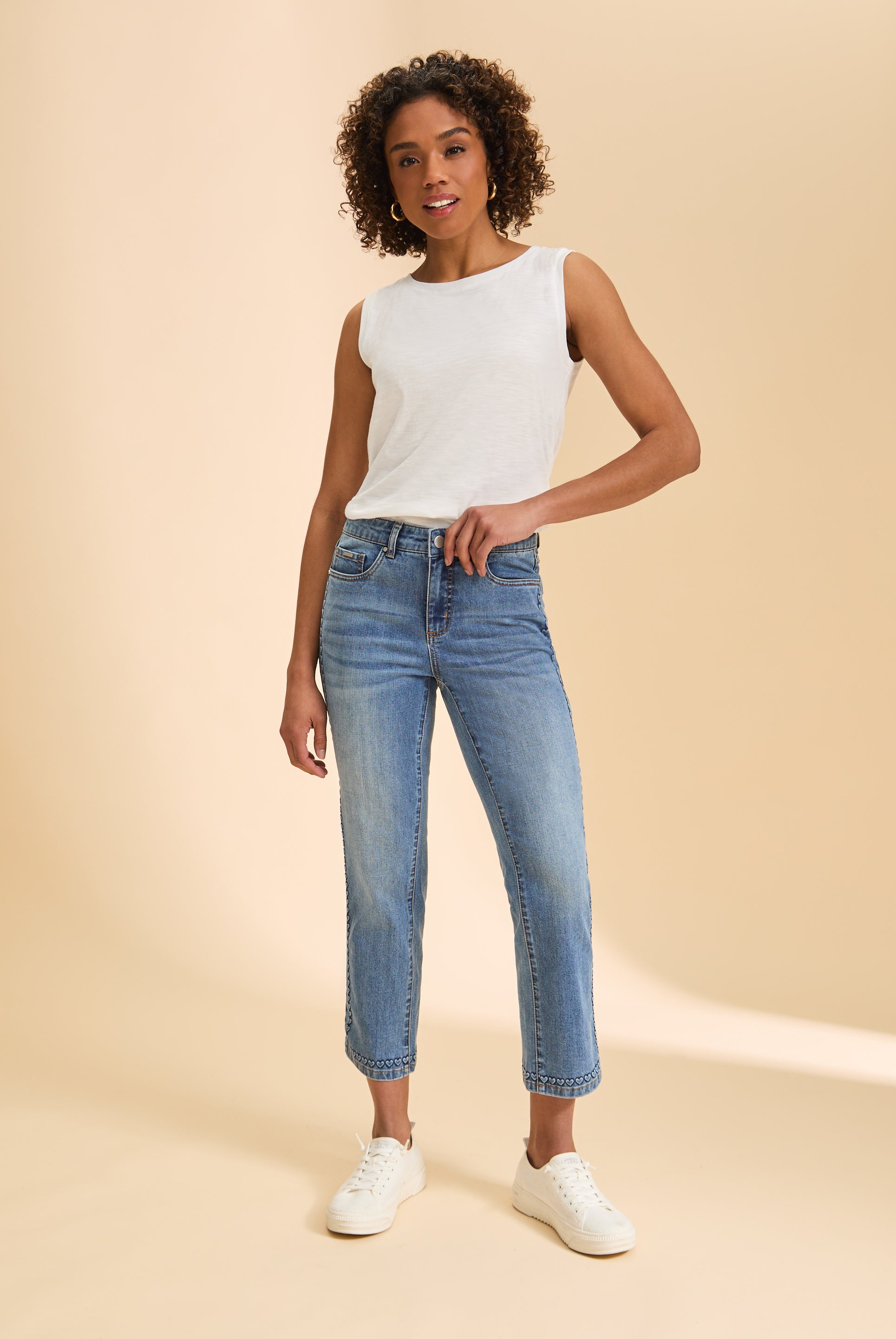 Full outfit with white sleeveless top and jeans highlighting timeless look by French Dressing Jeans (FDJ)