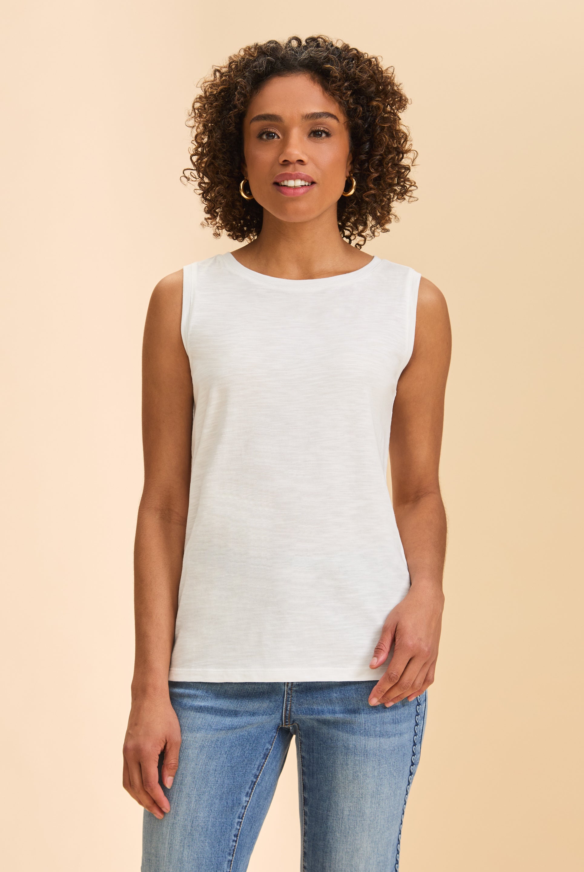 Front view of white sleeveless top with round neckline paired with classic denim by French Dressing Jeans (FDJ)