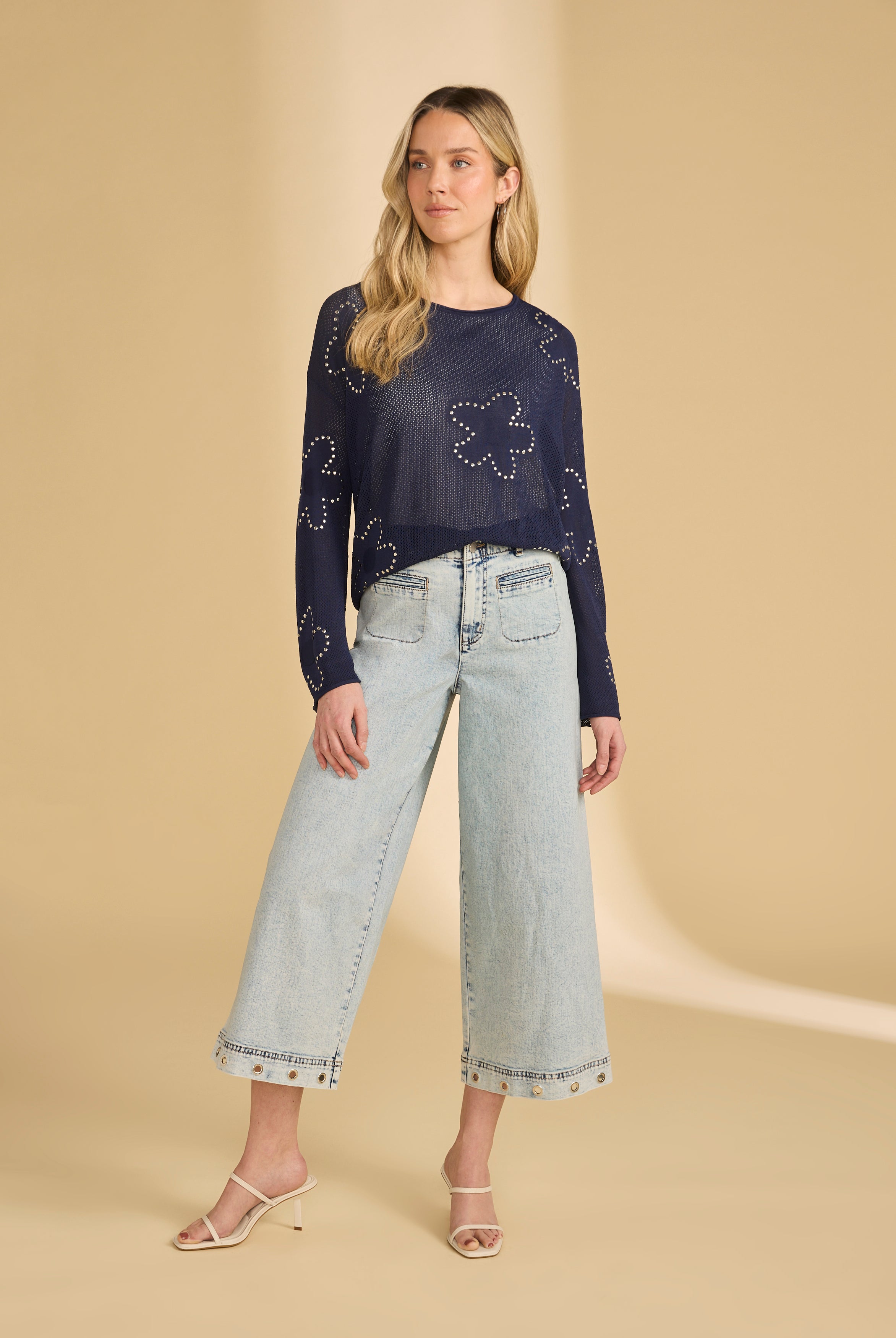 Full view of navy embellished sweater paired with light jeans by French Dressing Jeans (FDJ)
