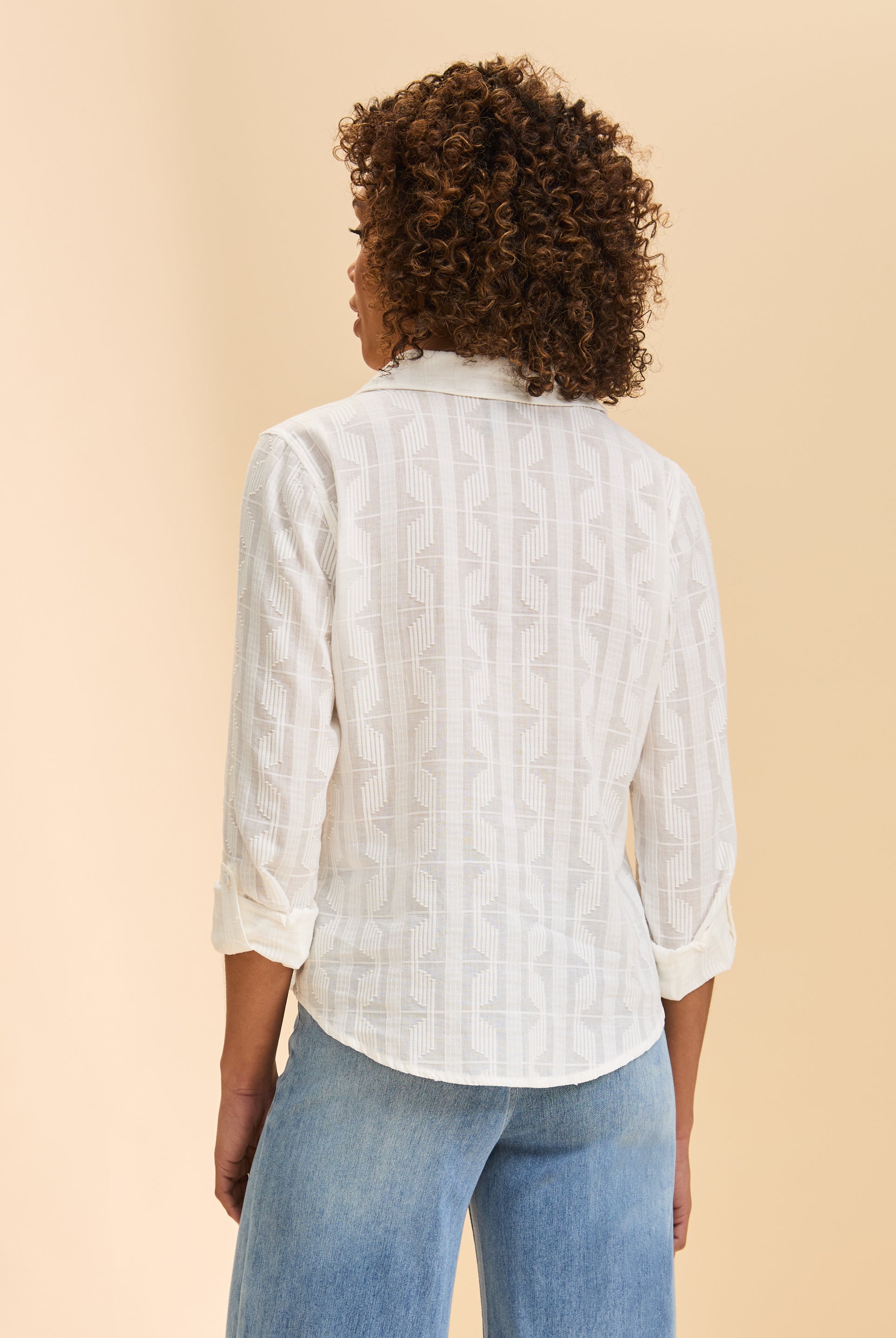 Back view of white textured shirt highlighting subtle pattern by French Dressing Jeans (FDJ)