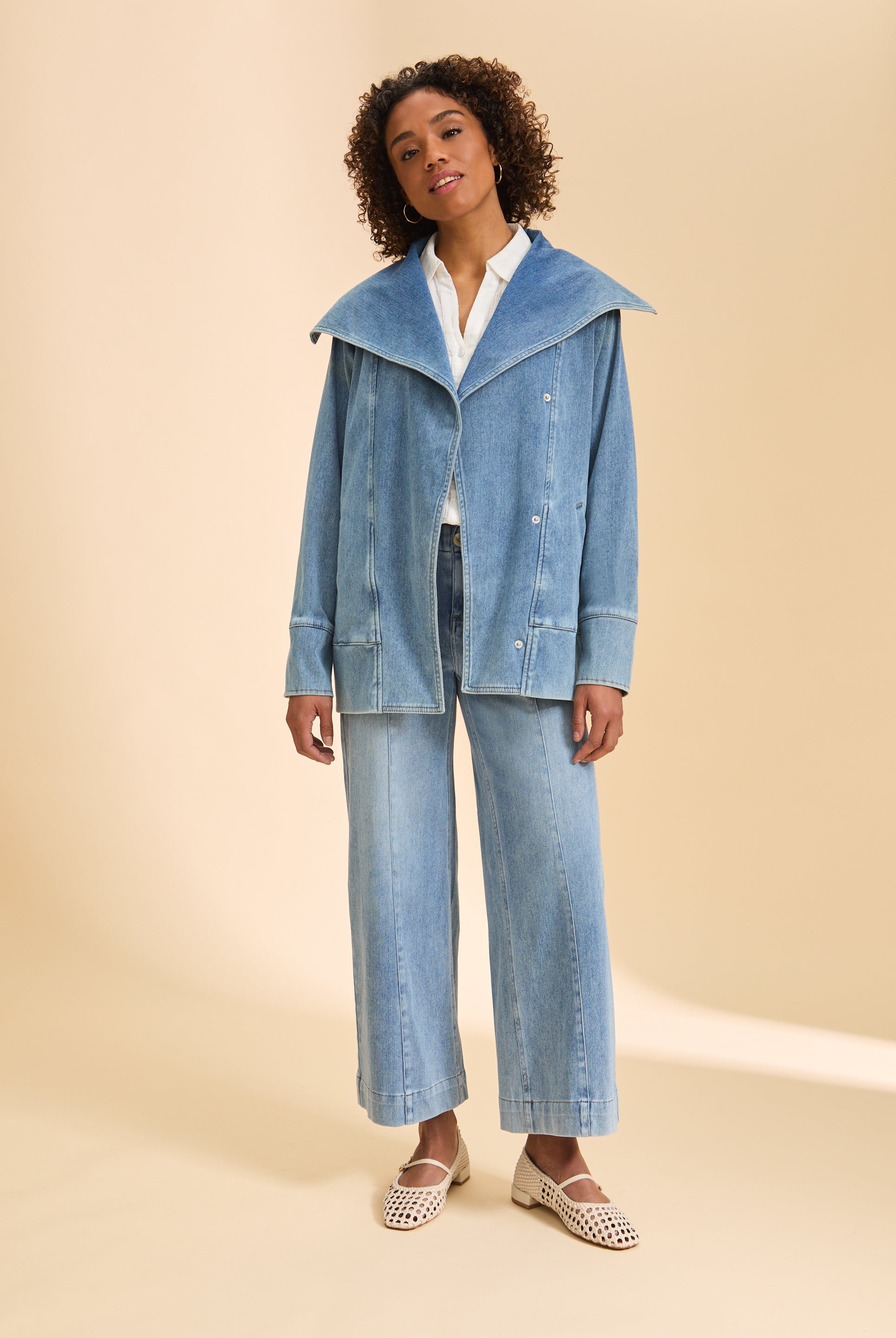 Full view of light blue denim jacket styled with wide-leg pants by French Dressing Jeans (FDJ)