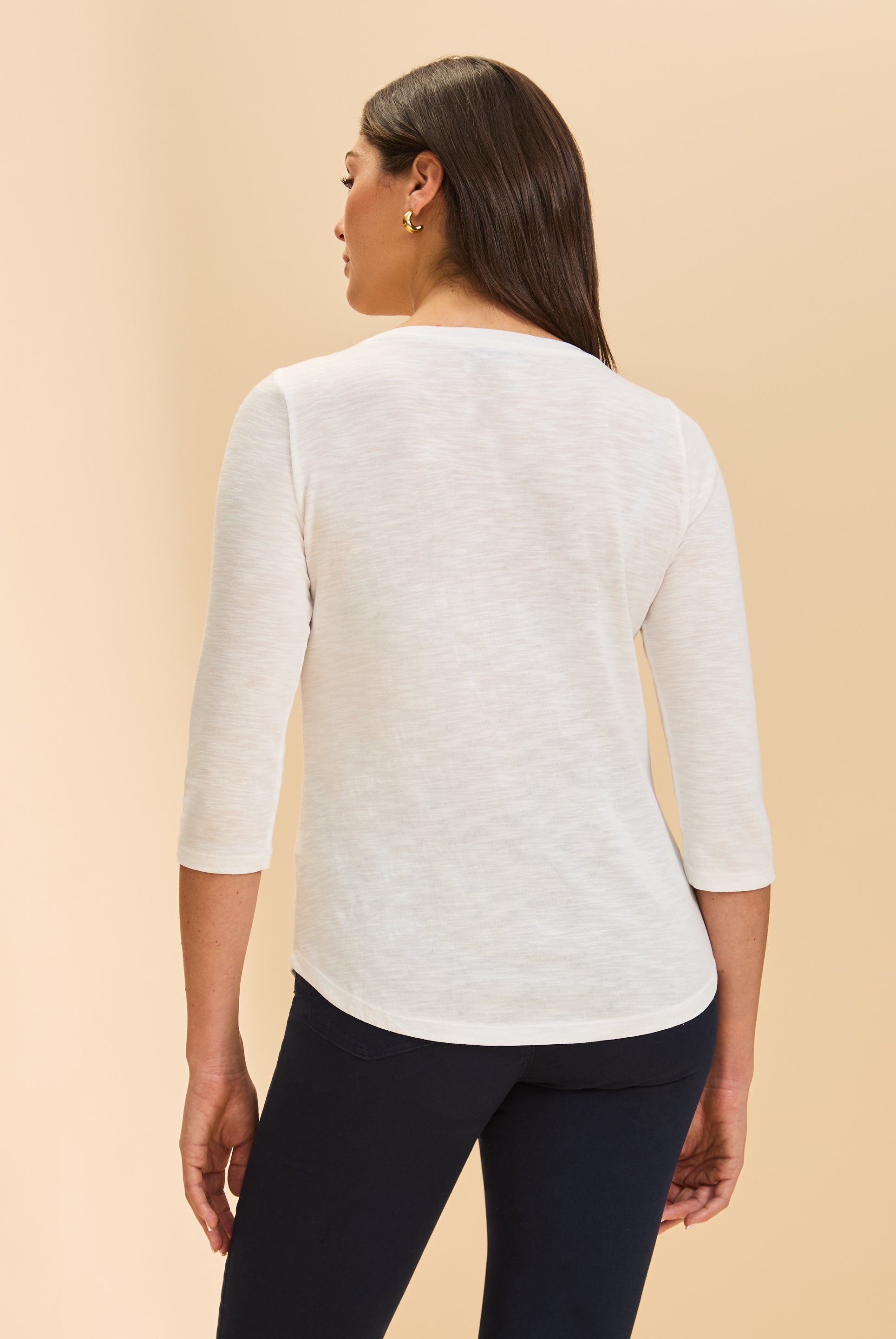 Back view of white V-neck 3/4 sleeve top showcasing versatile design by French Dressing Jeans (FDJ)