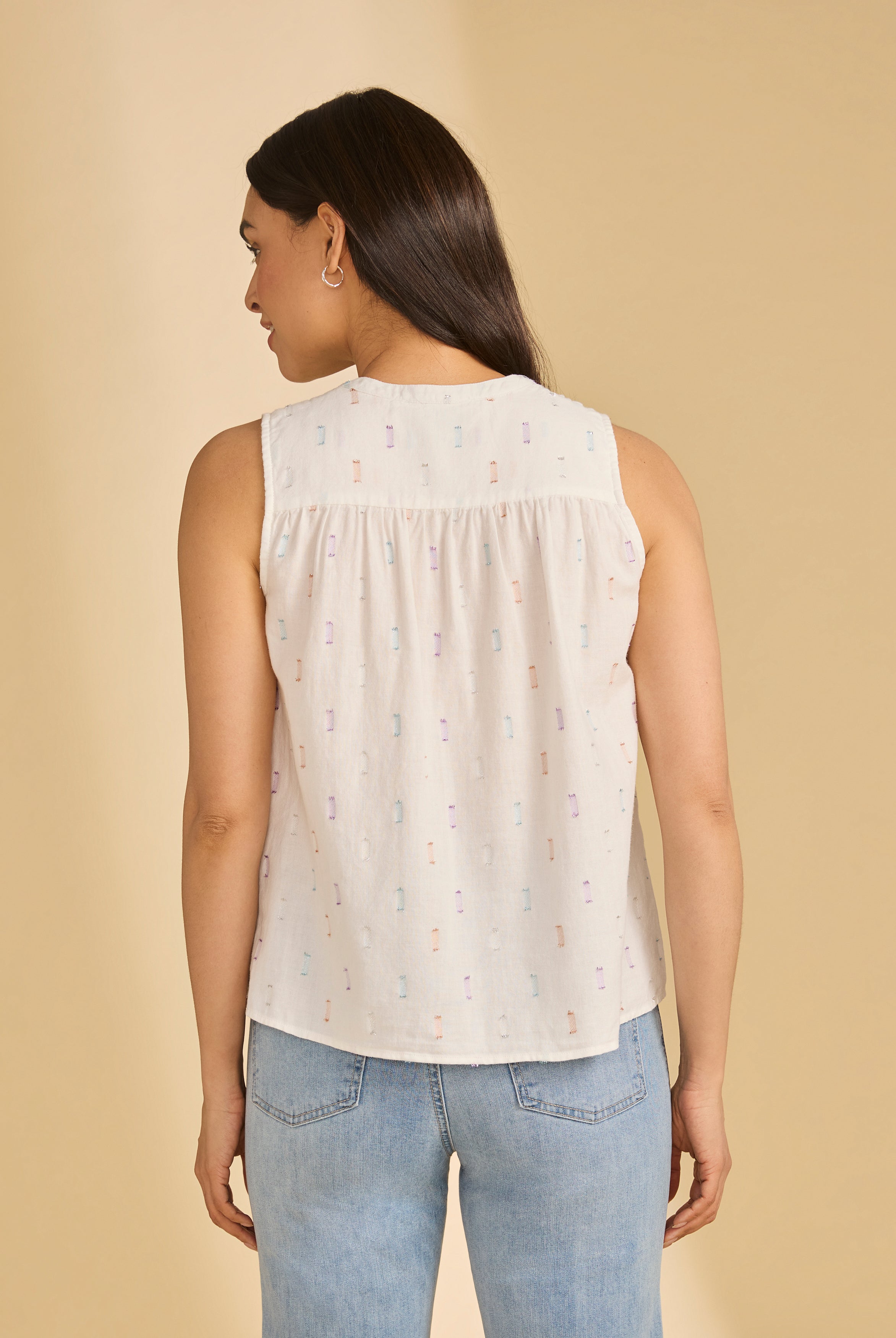 Back view of sleeveless white sparkle blouse, highlighting relaxed fit and subtle pattern, by French Dressing Jeans (FDJ)