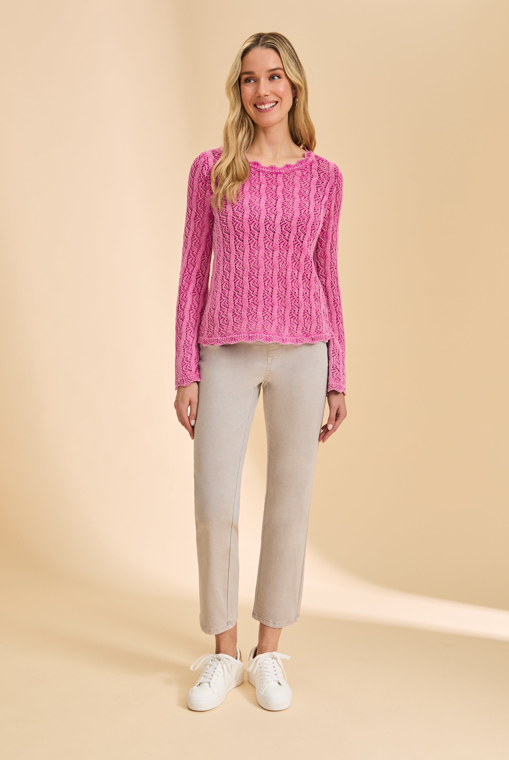 Full view of vibrant pink lace sweater styled with light pants by French Dressing Jeans (FDJ)