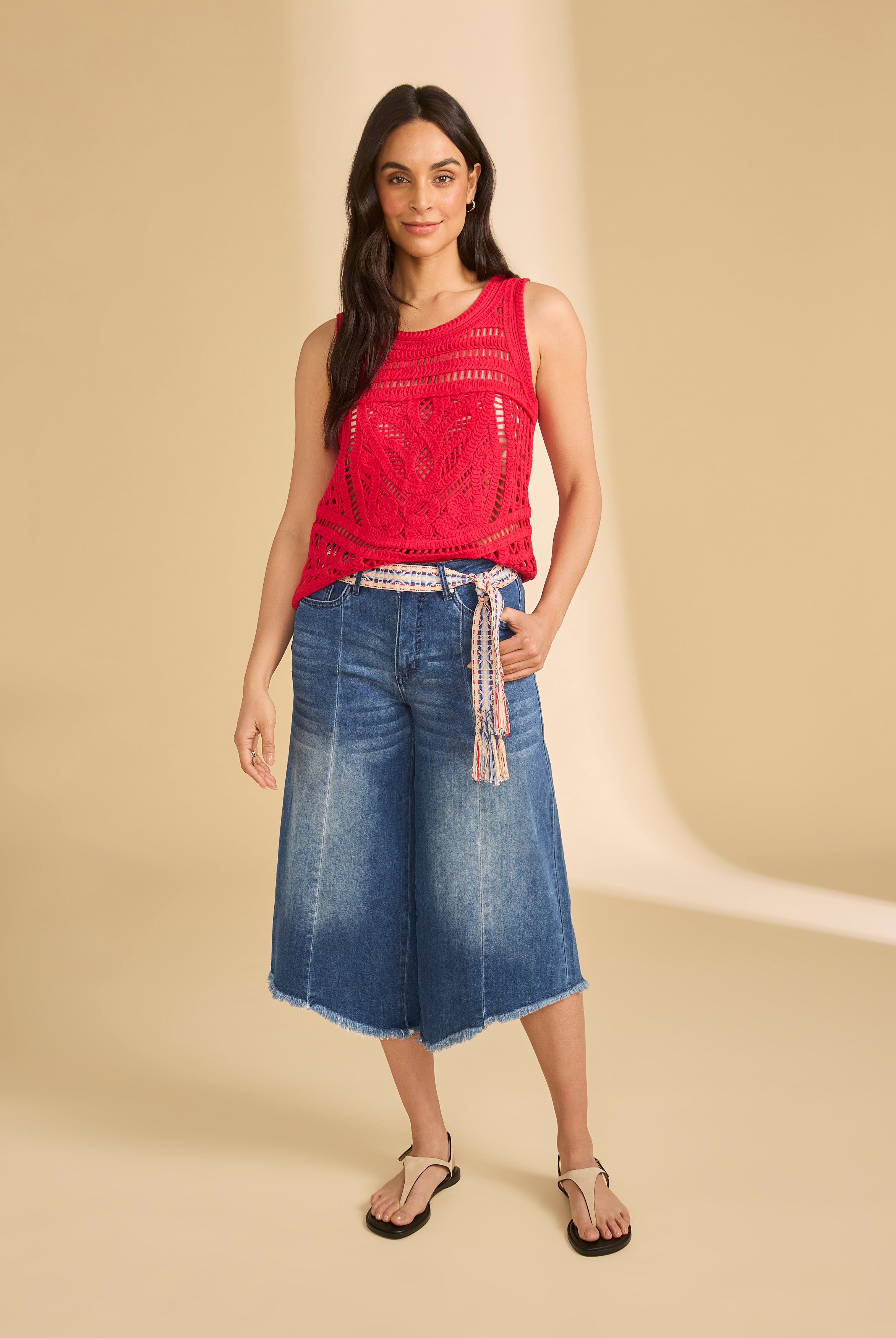 Full-body view of denim culottes with red crochet top and braided belt by French Dressing Jeans (FDJ)