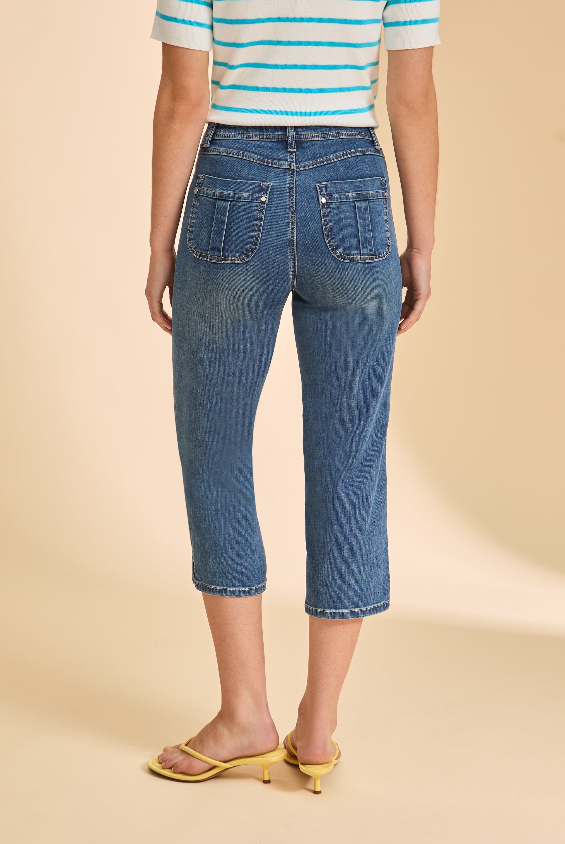 Back view of medium wash cropped jeans with patch pockets by French Dressing Jeans (FDJ)