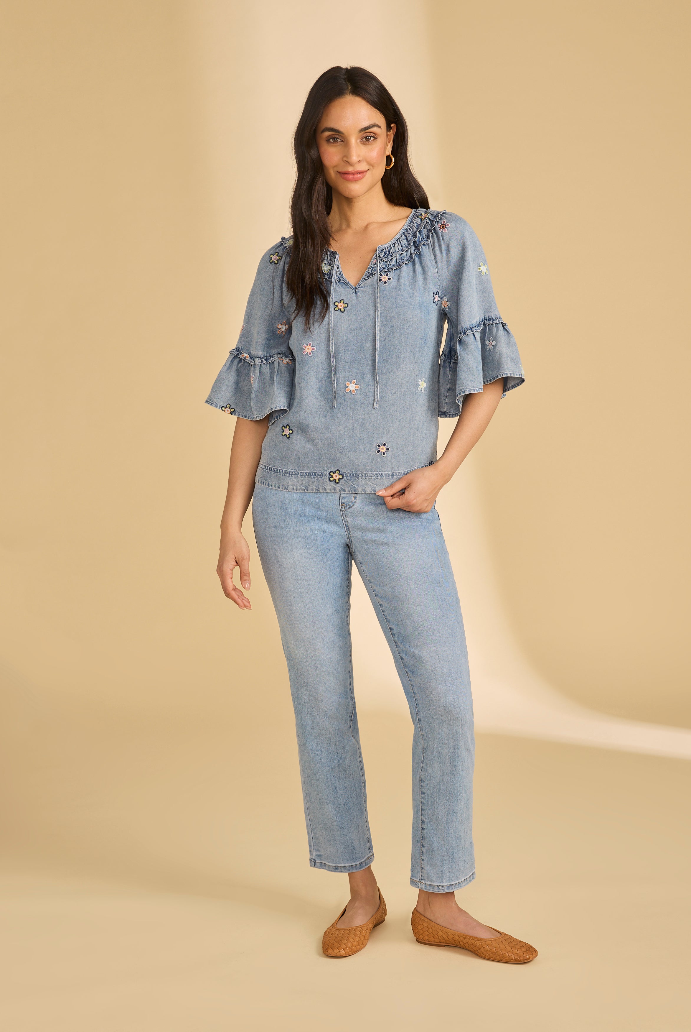 Full view of denim top with floral embroidery and straight-leg jeans by French Dressing Jeans (FDJ)