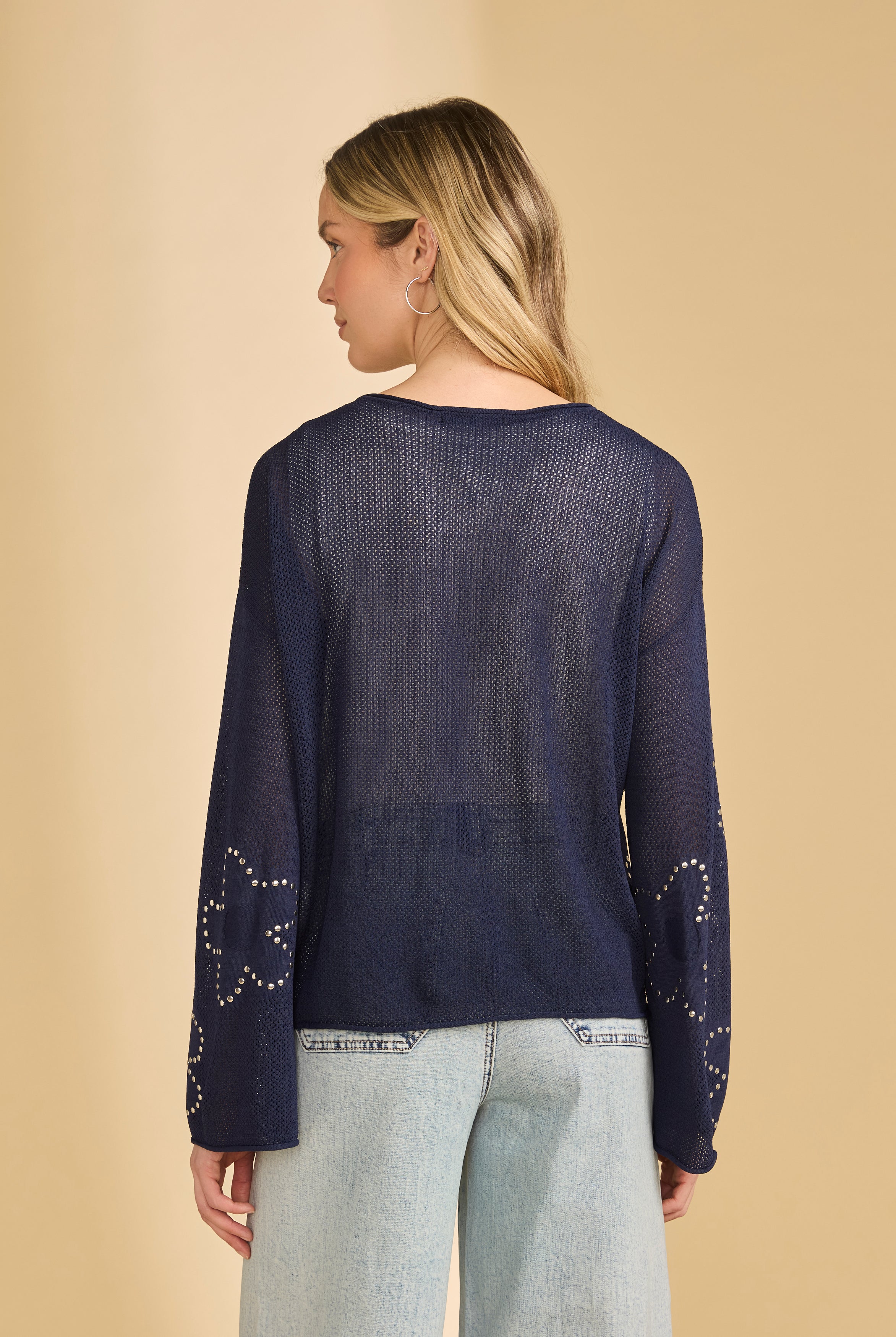 Back view of navy sweater showcasing sheer knit and relaxed fit by French Dressing Jeans (FDJ)