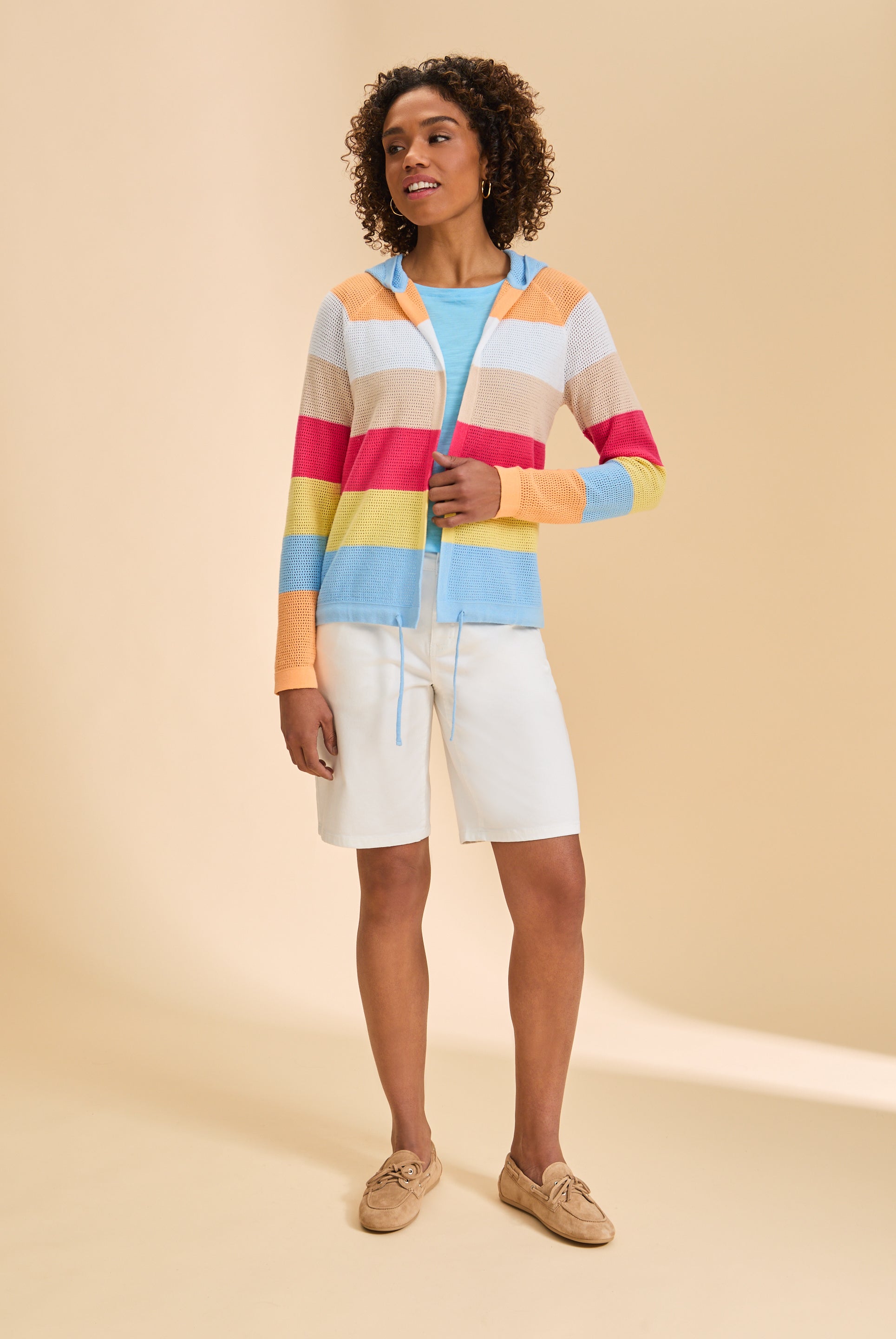 Full view of striped cardigan paired with white shorts, highlighting versatile style by French Dressing Jeans (FDJ)