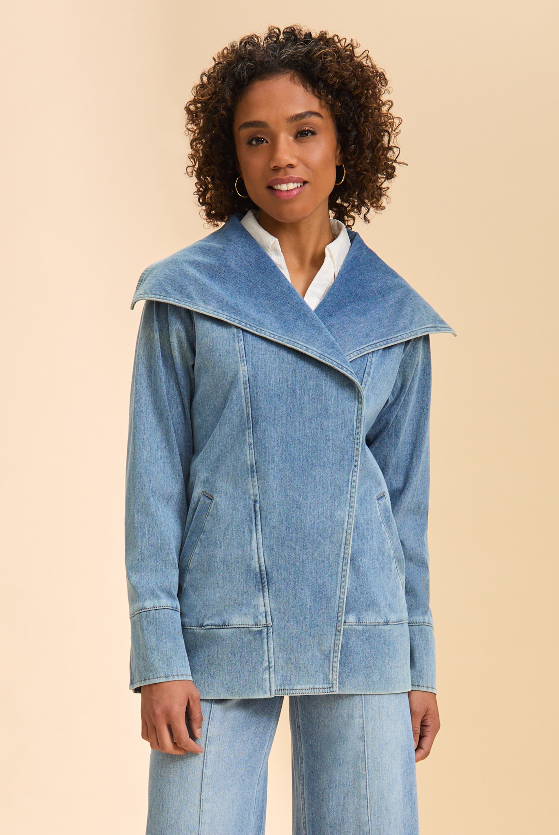 Front view of light blue denim jacket with wide collar and welt pockets by French Dressing Jeans (FDJ)