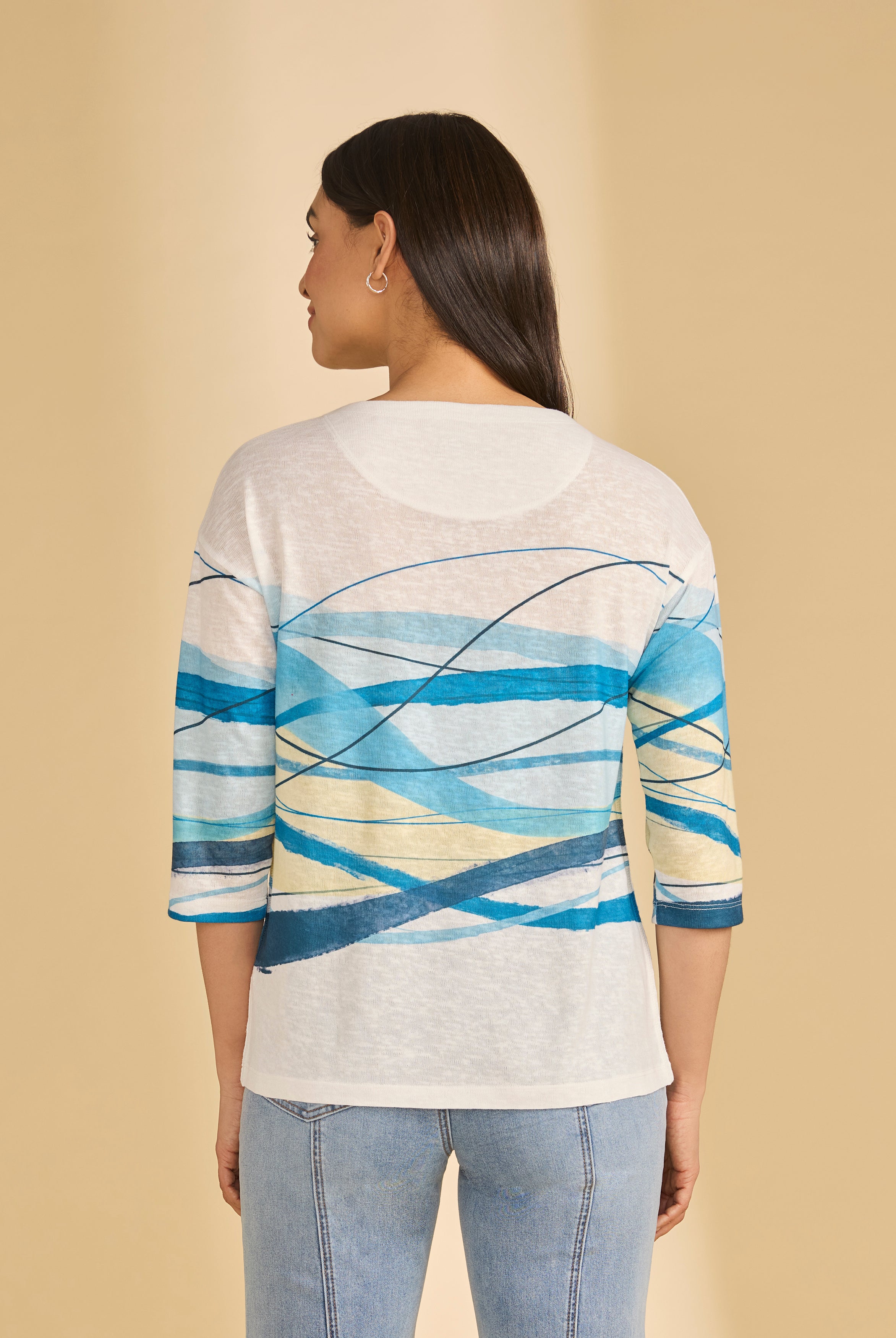 Back view of white top featuring blue wave design and casual fit by French Dressing Jeans (FDJ)