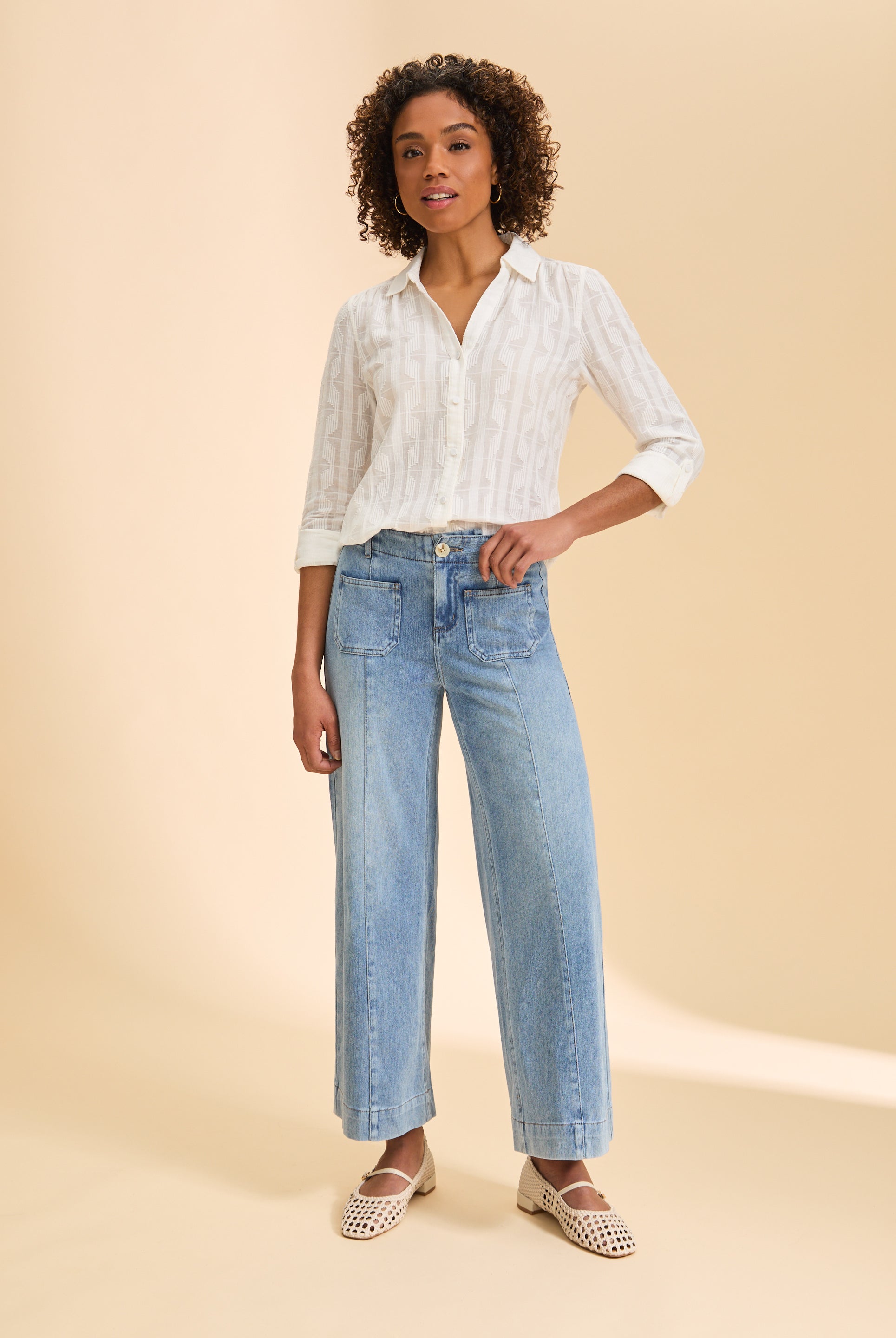 Full view of white textured shirt styled with light denim jeans by French Dressing Jeans (FDJ)