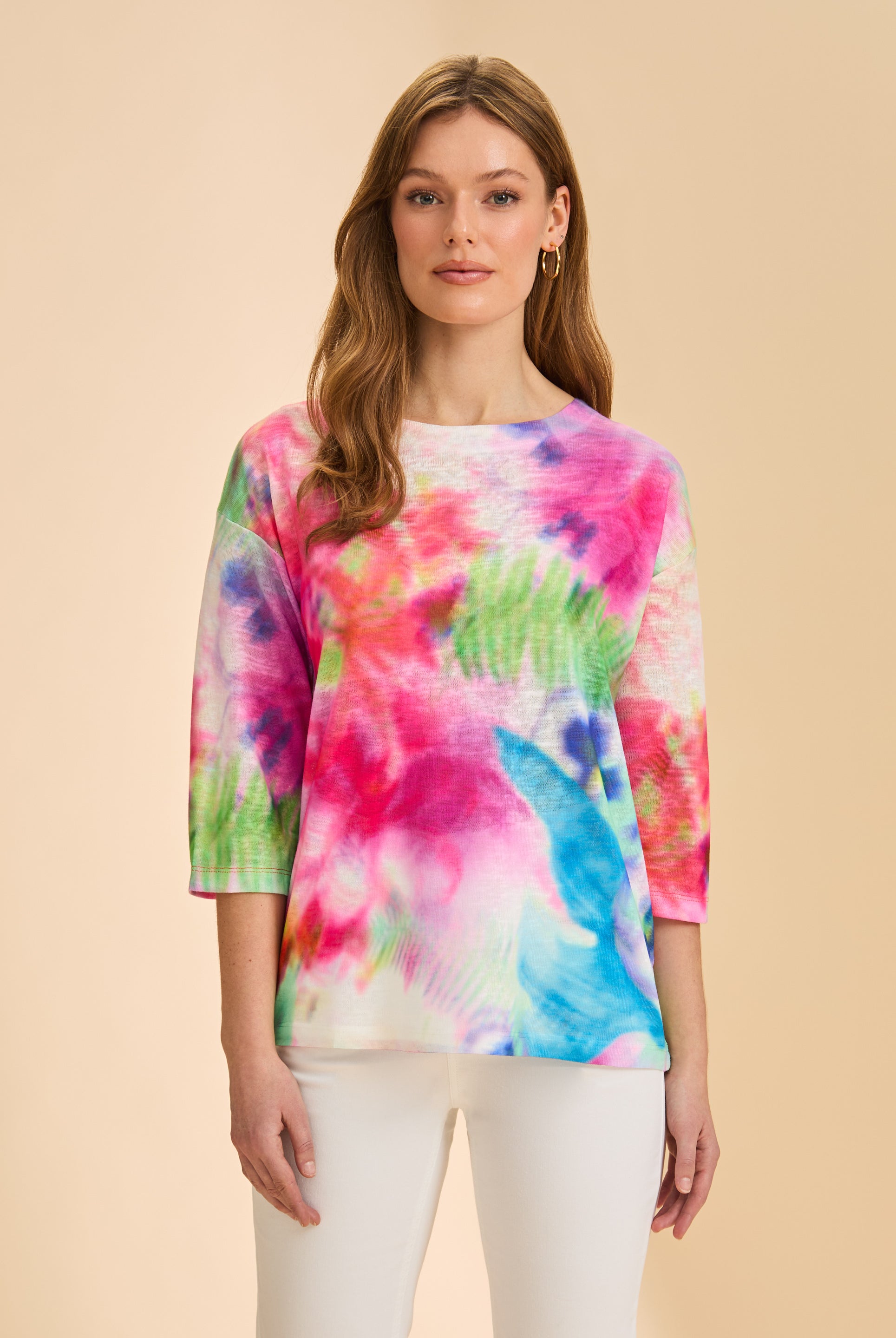 Front view of vibrant floral 3/4 sleeve top with white pants by French Dressing Jeans (FDJ)