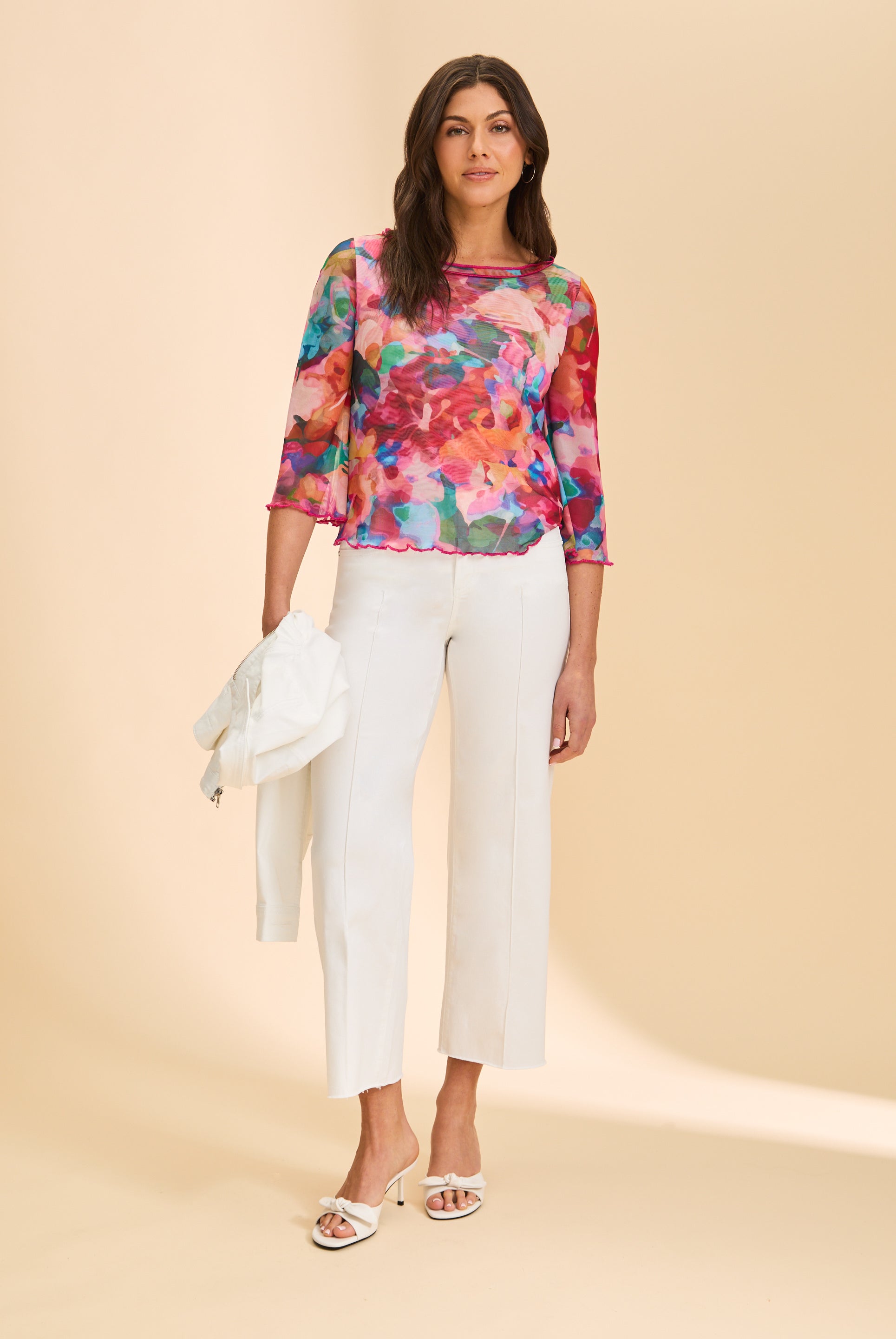 Full view of colorful sheer top with white pants and heels by French Dressing Jeans (FDJ)