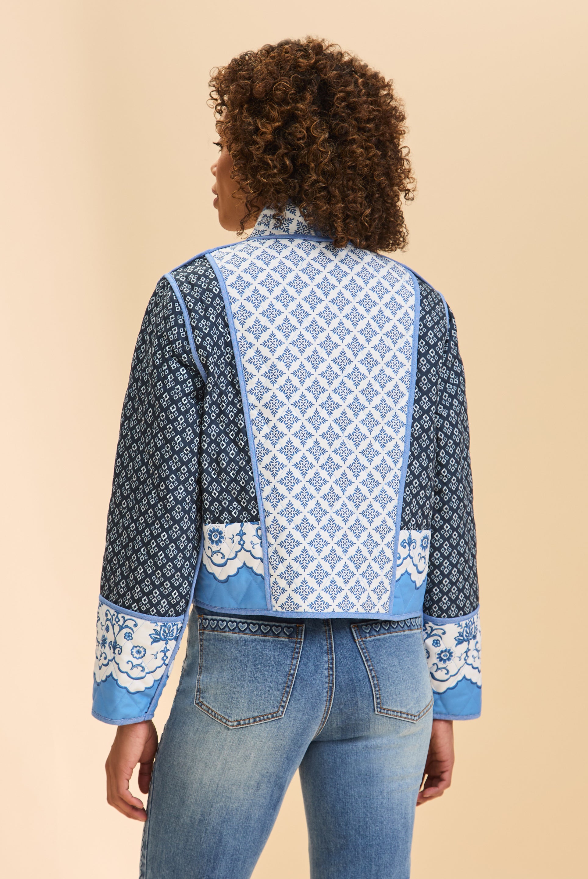 Back view of blue quilted jacket featuring geometric patterns and long sleeves by French Dressing Jeans (FDJ)