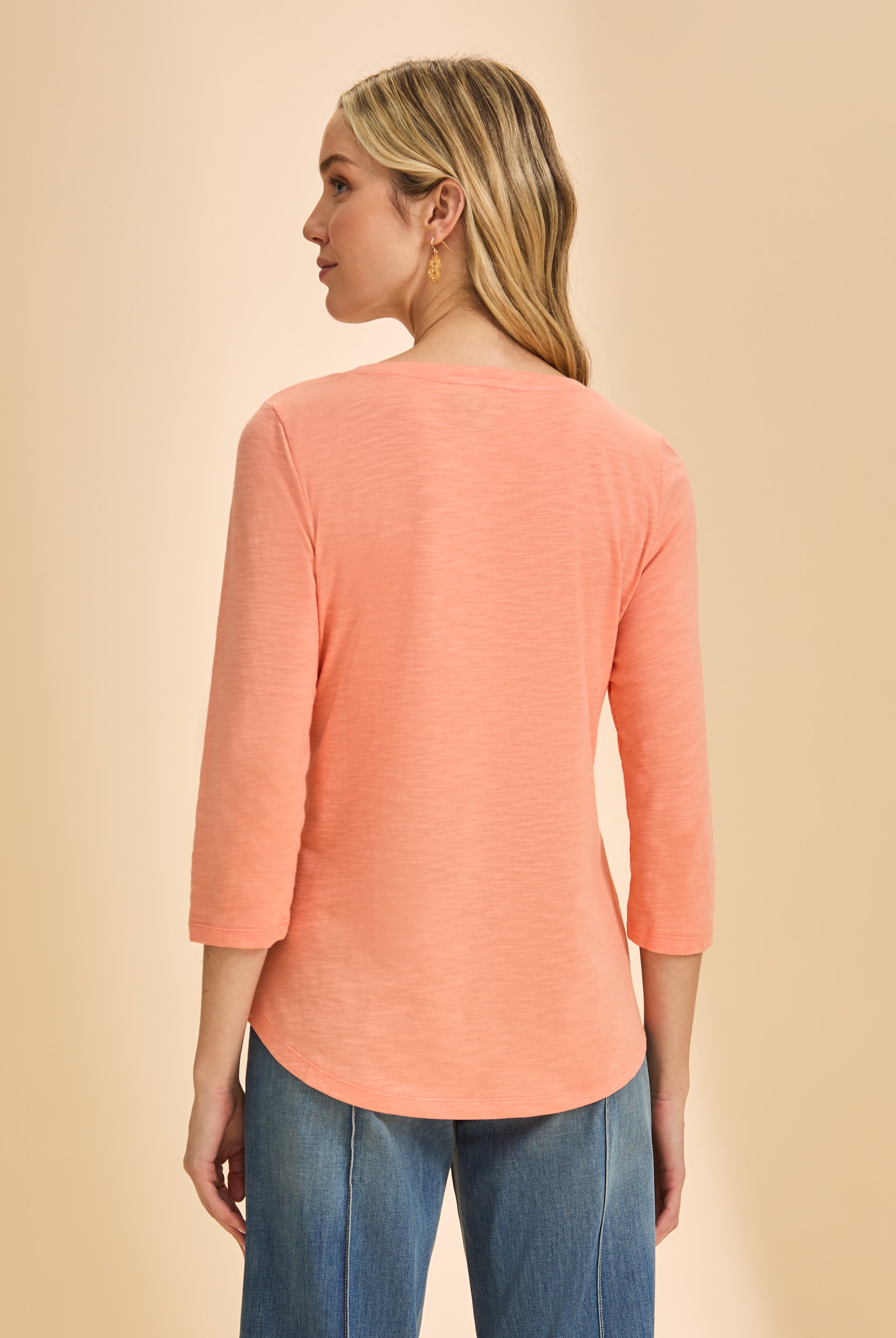 Back view of coral V-neck 3/4 sleeve top showing relaxed fit and smooth fabric by French Dressing Jeans (FDJ)