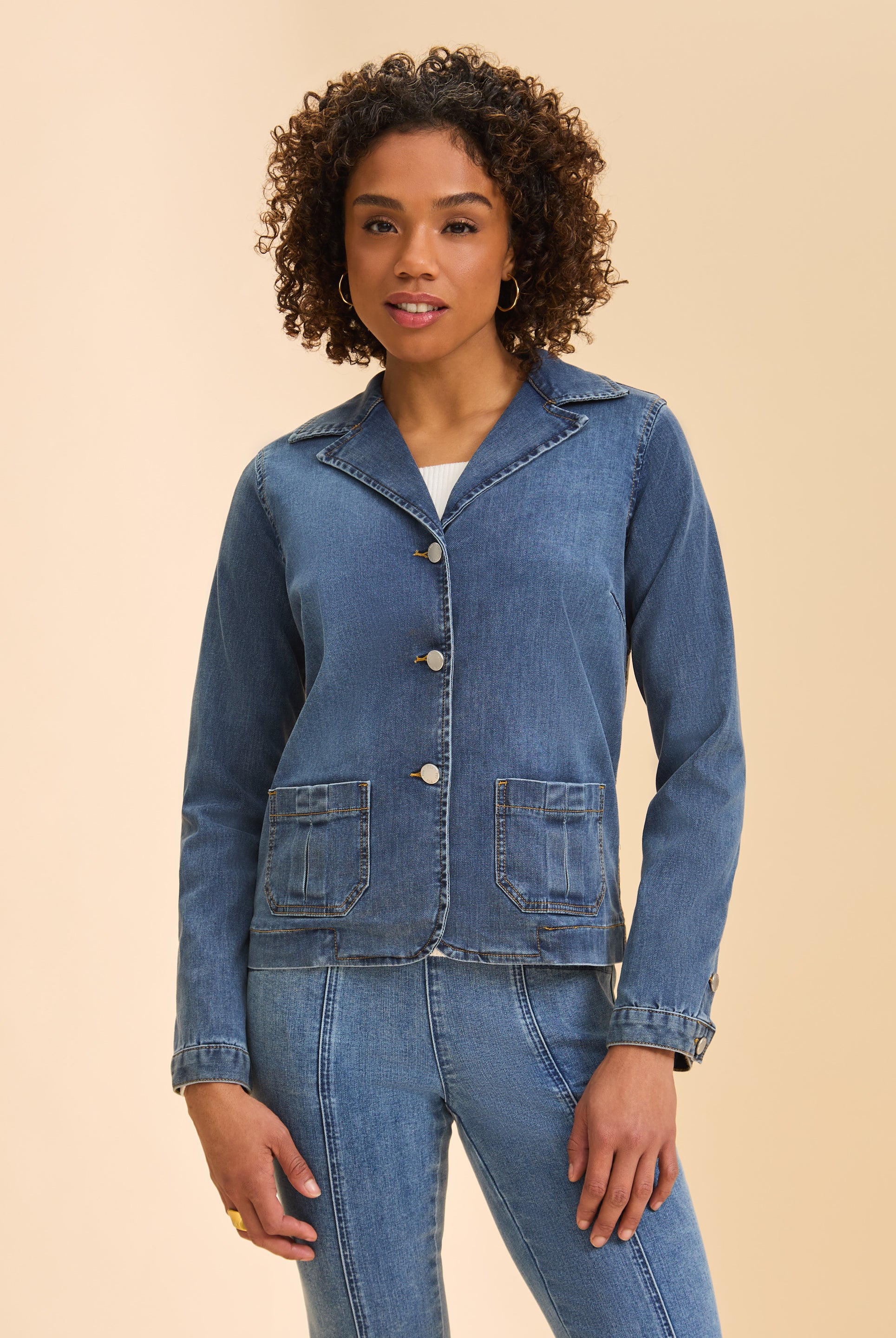 Front view of women's medium wash denim blazer jacket with patch pockets by French Dressing Jeans (FDJ)