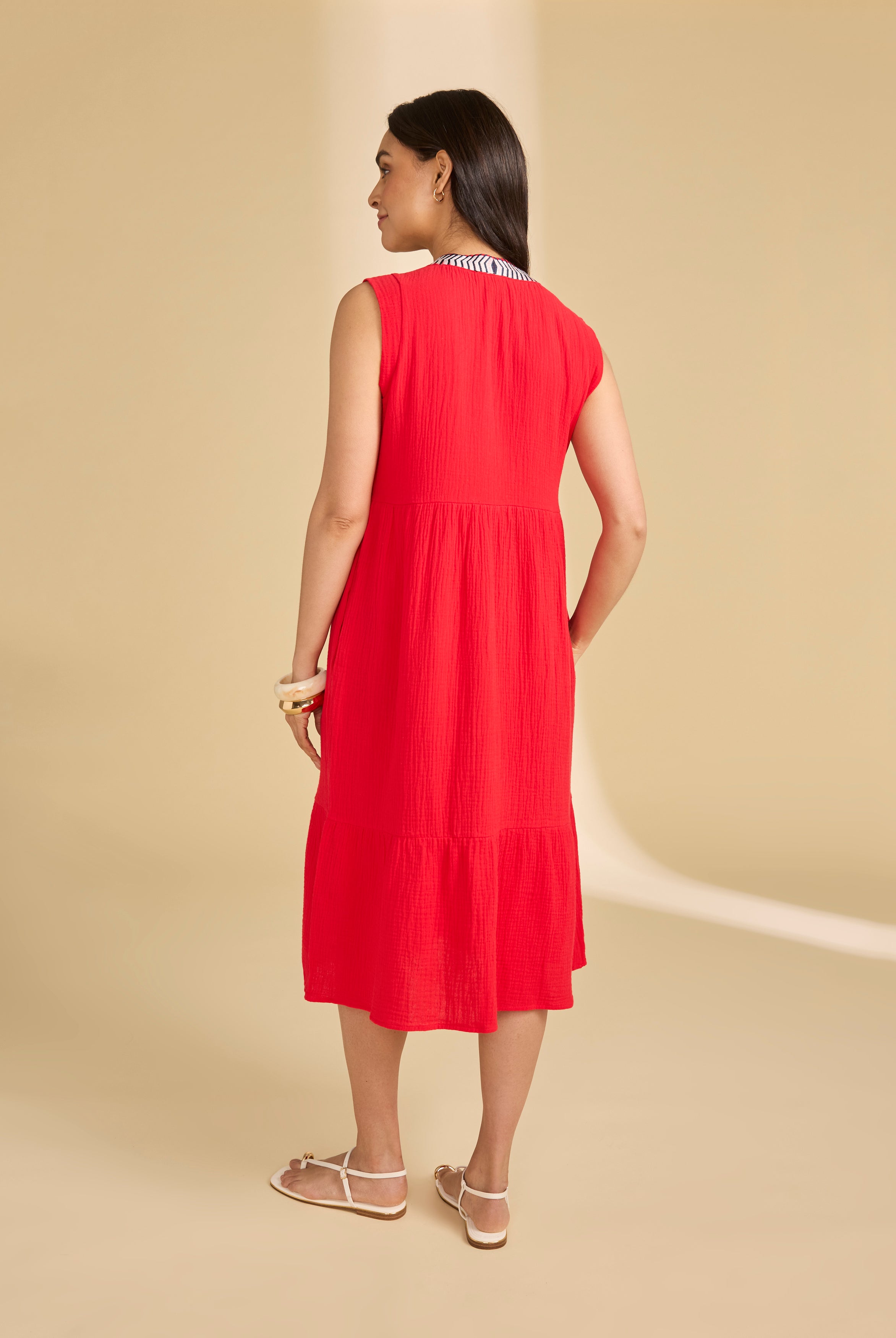 Back view of lava red tiered midi dress showing seamless flow and sleeveless design by French Dressing Jeans (FDJ)