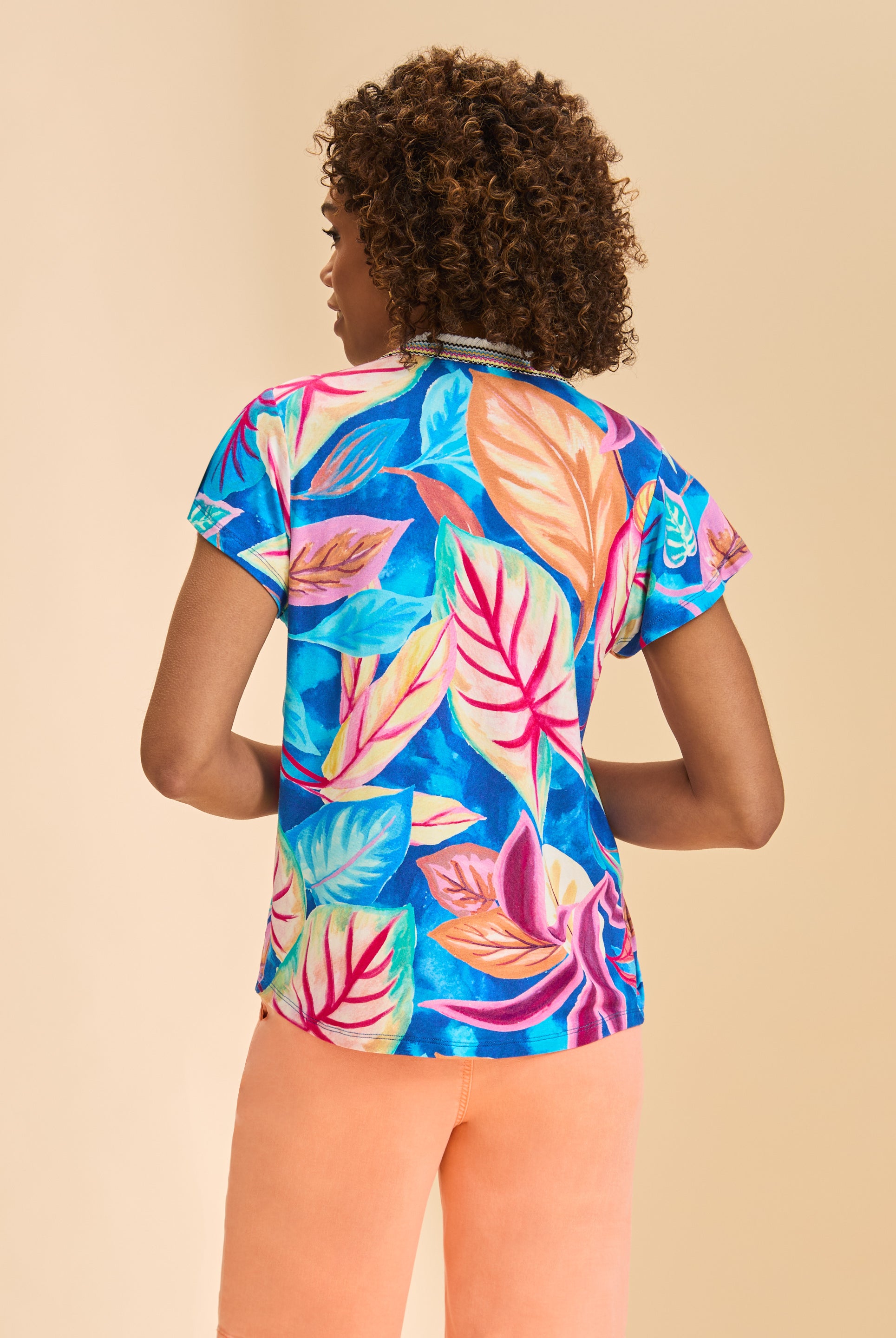 Back view of Flutter Sleeve Pintuck Top showcasing vibrant floral pattern by French Dressing Jeans (FDJ)
